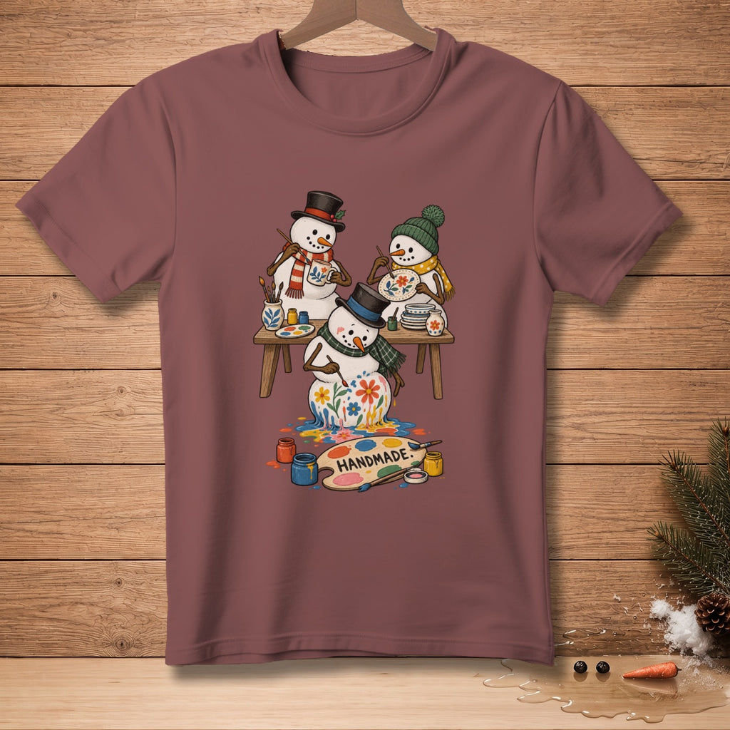 Three snowmen painting together, with "HANDMADE" text on a palette.