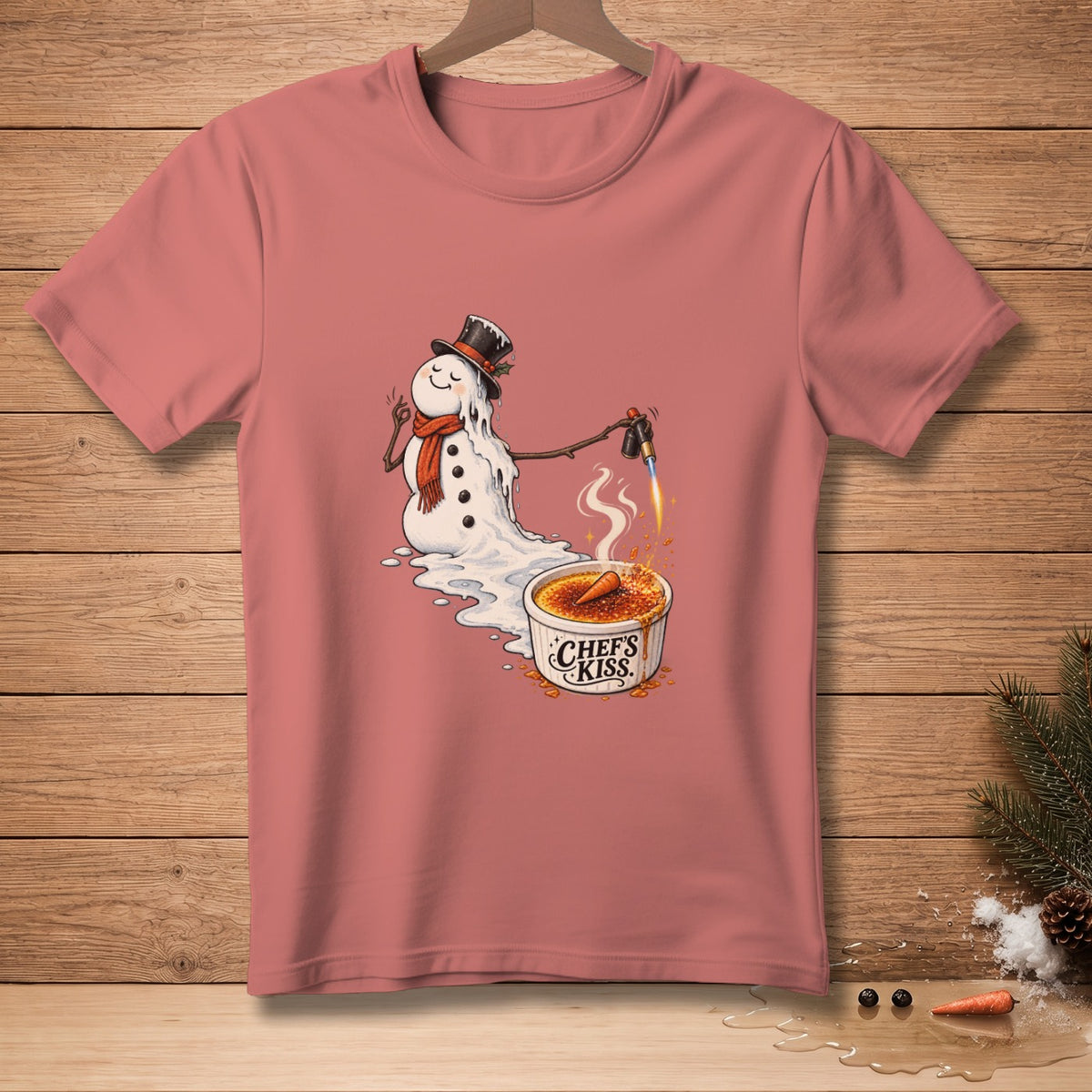 Melting snowman with a torch caramelizing a crème brûlée with "Chef's Kiss" text.