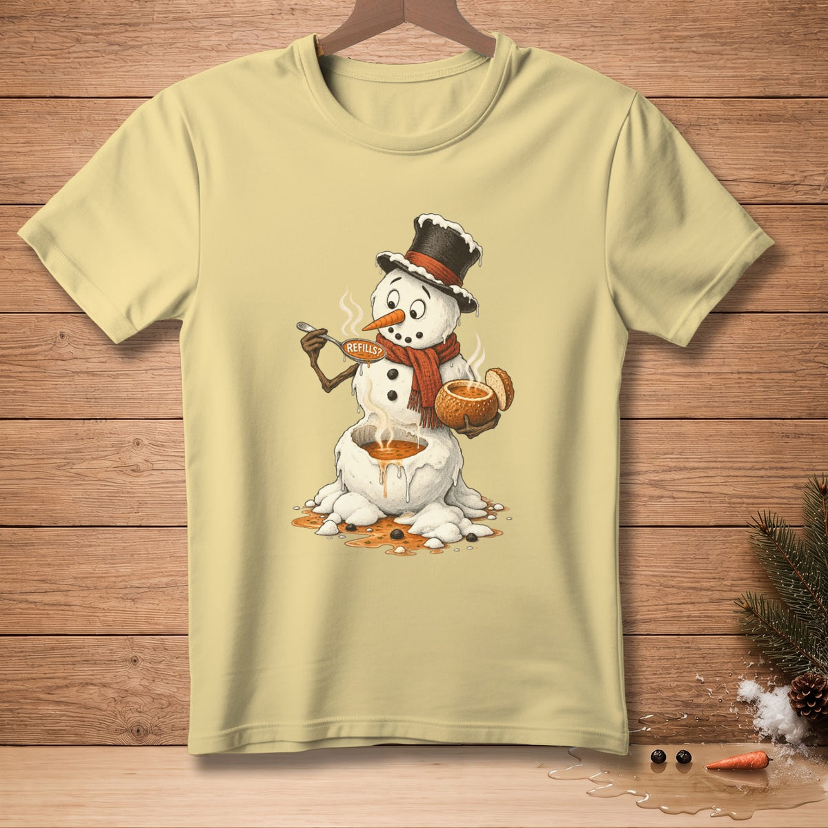 Yellow t-shirt with illustration of melting snowman holding a spoon and bowl of soup.