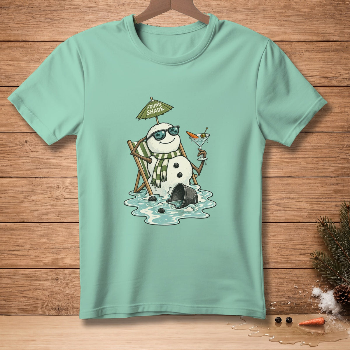 Melting snowman in lounge chair under umbrella with cocktail, text "Found Shade".