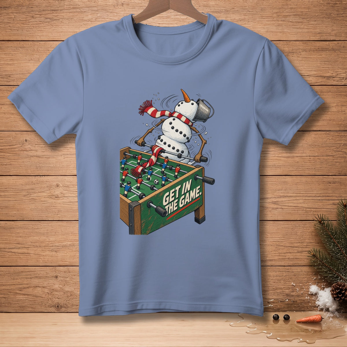 Snowman playing foosball with "Get in the Game" text.