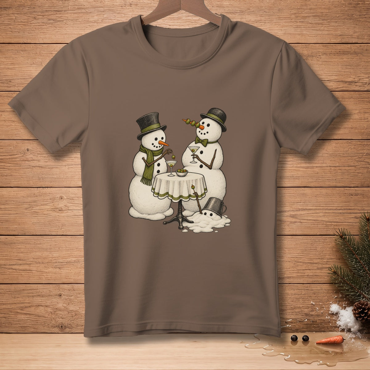 Two snowmen with top hats drink martinis at a table, one melting.