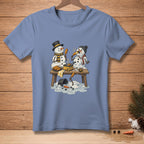 Two snowmen, one melting, enjoy corn dogs at a wooden table.