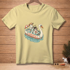 Three snowmen in a swan-shaped boat with "Romantic" text, on a yellow t-shirt.