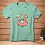 Mint t-shirt with a snowman in a flamingo float and two flamingos.