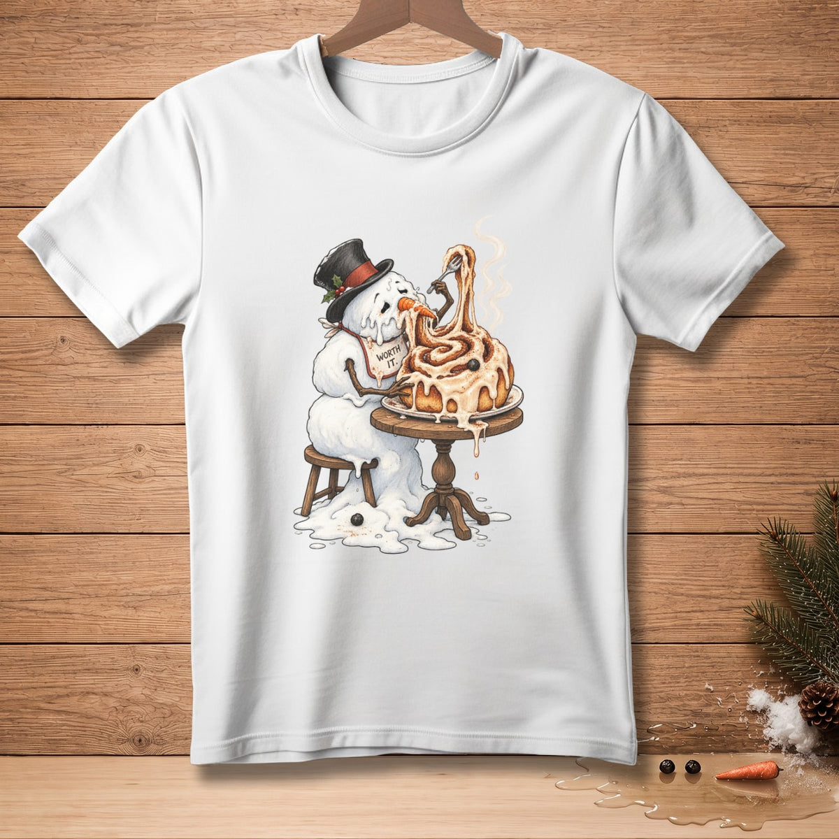 Snowman in top hat eating cinnamon roll, wearing "Worth It." bib.