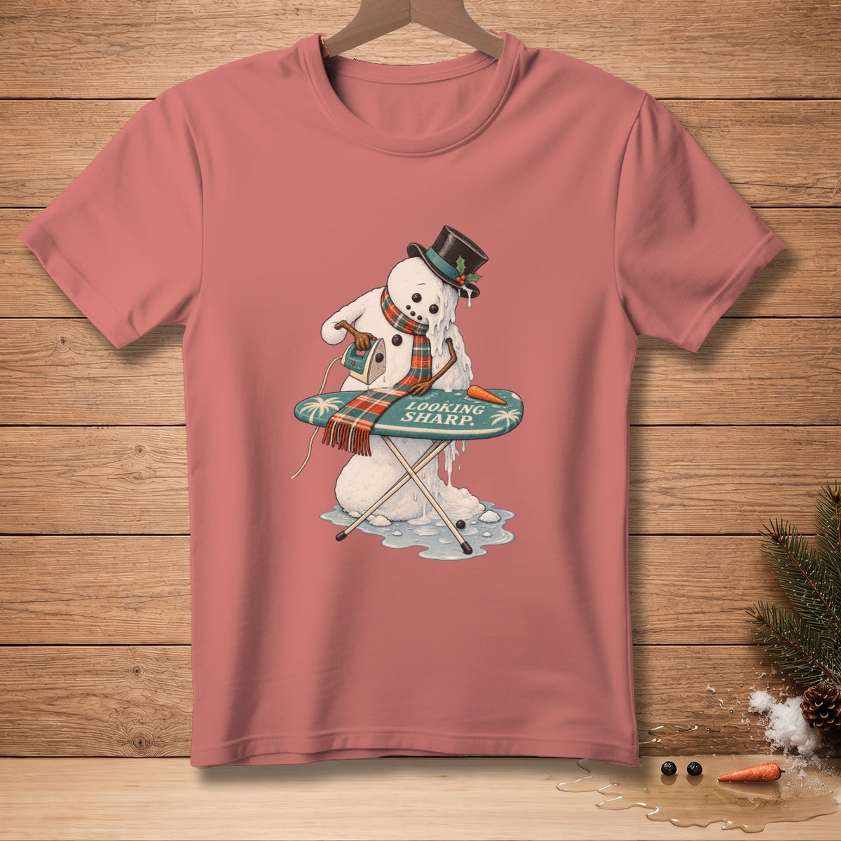 Melting snowman with top hat irons on an ironing board with text "LOOKING SHARP."