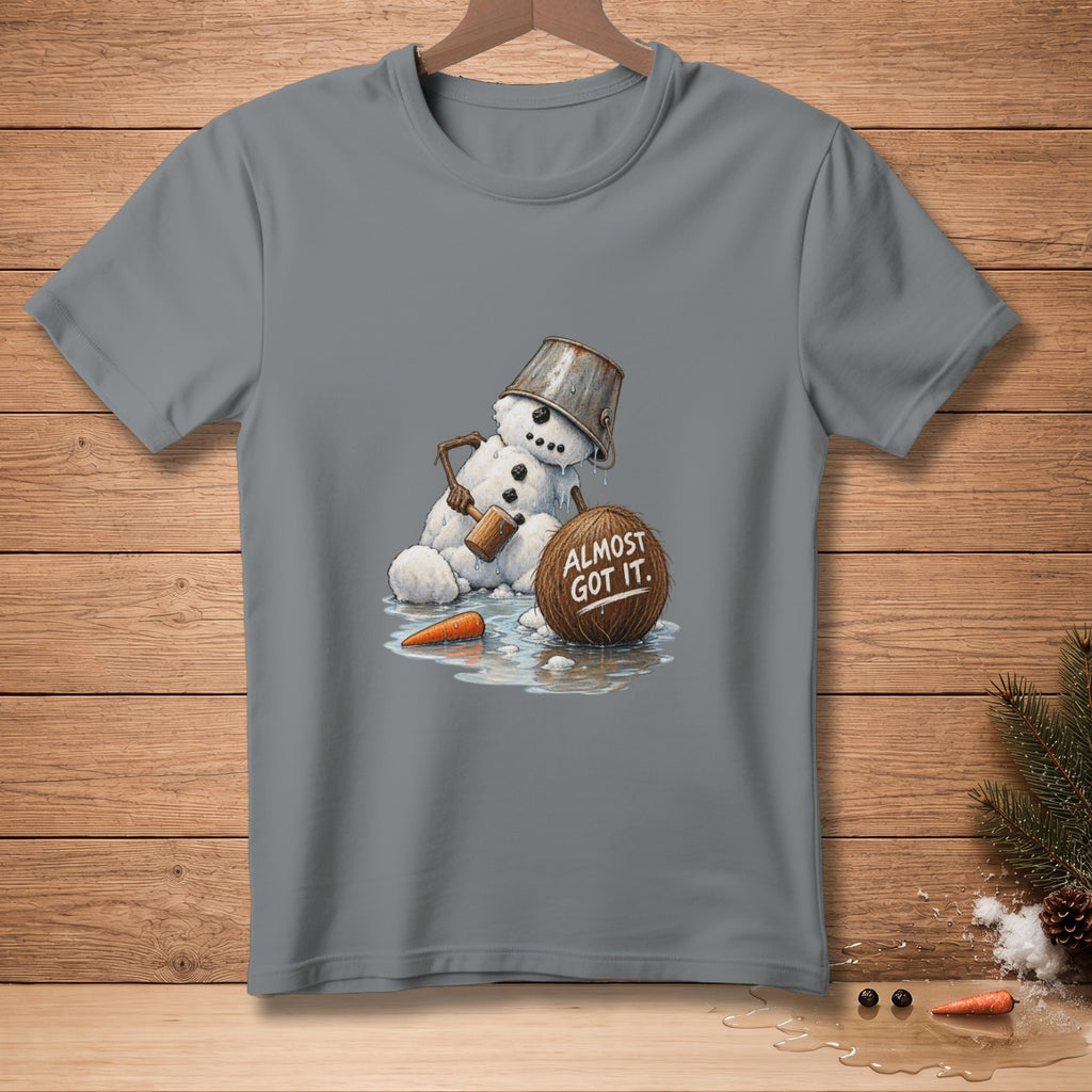 Melting snowman with a bucket on head, holding a hammer near a coconut that says "Almost Got It."