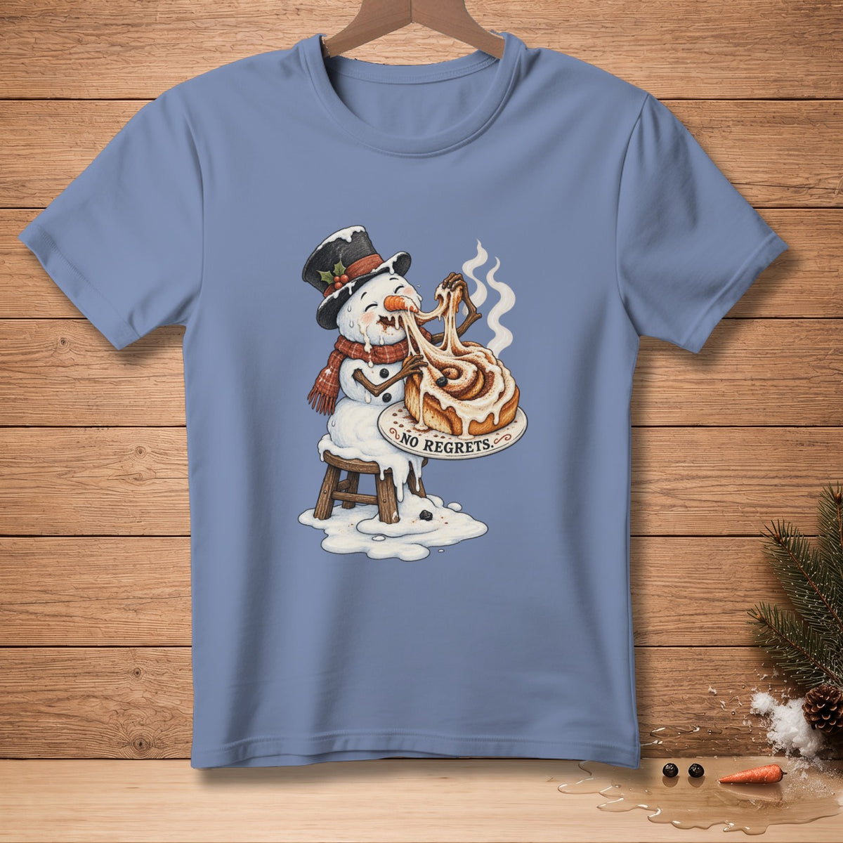 Snowman melting while eating a cinnamon roll with "NO REGRETS" text.