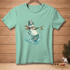 Snowman surfing on a surfboard with "Still Up" text, wearing a bucket hat and scarf.