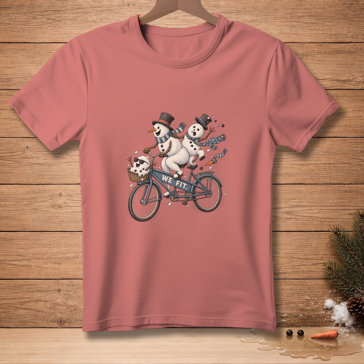 Two snowmen on a tandem bicycle with "WE FIT." text on the frame.