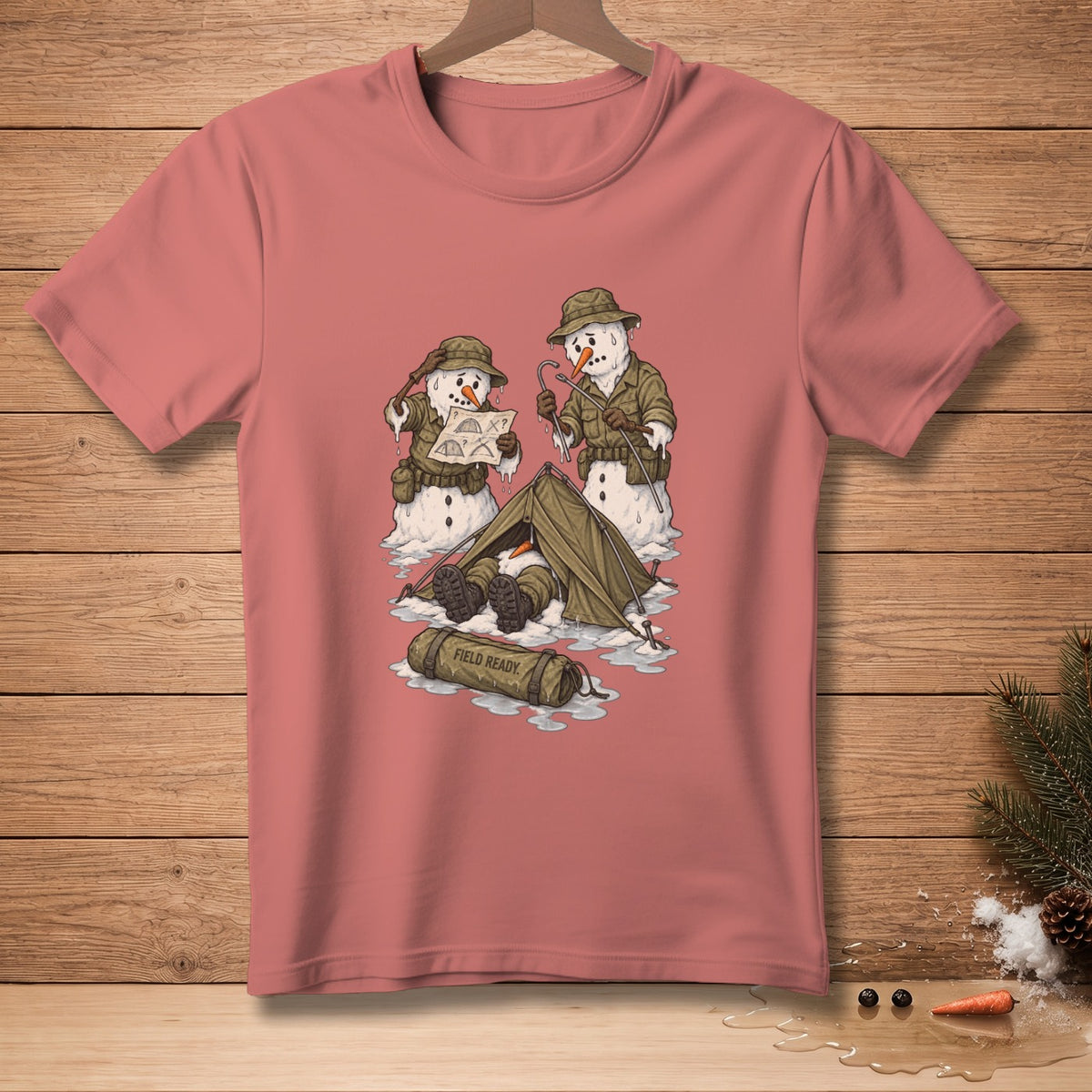 T-shirt graphic of melting snowmen camping with text "FIELD READY" on a bag.
