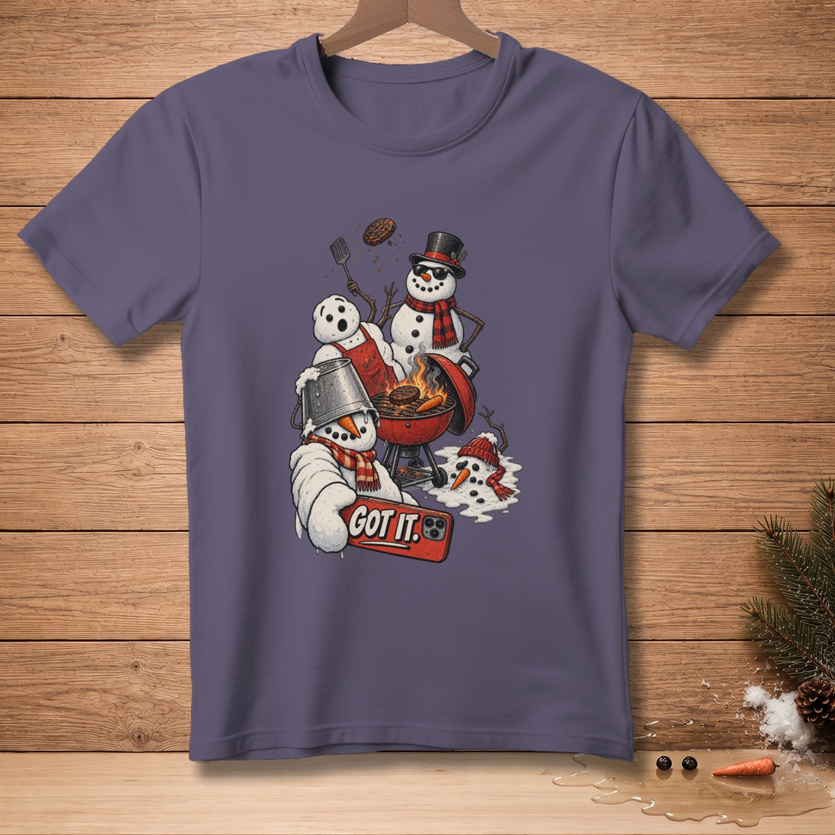 Snowmen grilling with a burger, text "GOT IT." on a phone.