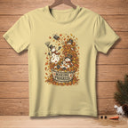 Yellow t-shirt with snowmen playing in autumn leaves and text "MAKING PROGRESS."