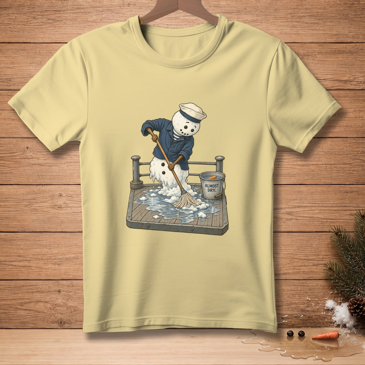Snowman in sailor outfit mopping a wet deck with a bucket labeled "Almost Dry."