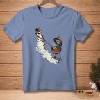 Snowman with top hat and sunglasses grilling a pineapple ring and carrot with "Safety First" text.