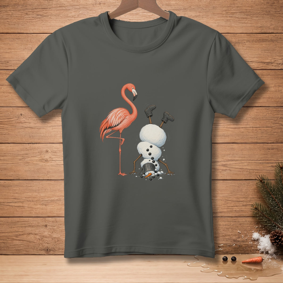 Flamingo and upside down snowman graphic on a dark grey t-shirt.