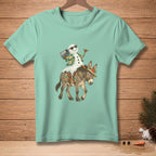 Snowman in sunglasses riding a donkey wearing a straw hat and tropical shirt.