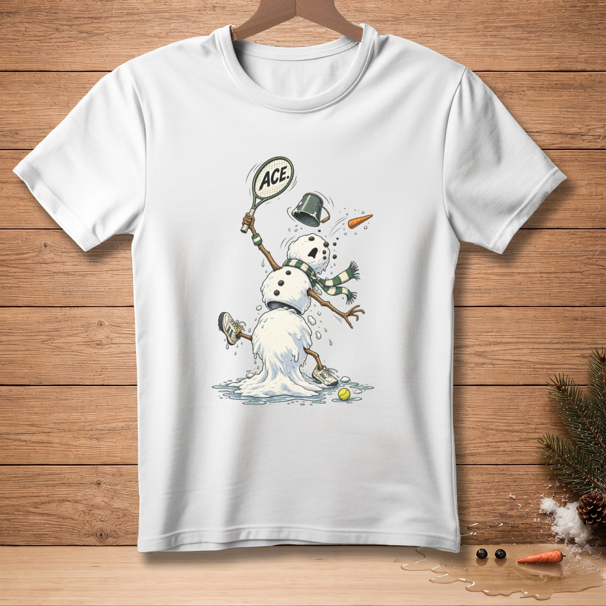 White t-shirt with cartoon snowman playing tennis, text "ACE" on racket.