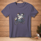 T-shirt with two snowmen riding a tandem bicycle, with "WE FIT." text.
