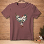 T-shirt with distressed graphic of snowmen relaxing in a hammock reading a book and wearing hats.
