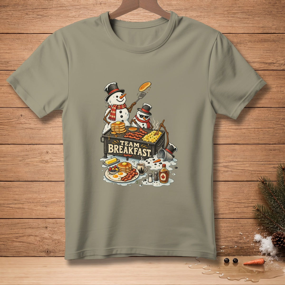 Two snowmen cook a large breakfast with "TEAM BREAKFAST" text.