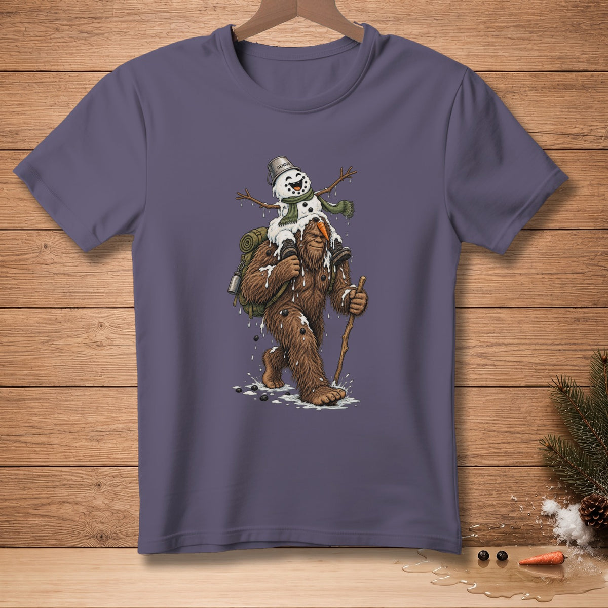 Bigfoot carrying a melting snowman with a bucket hat on his shoulder.