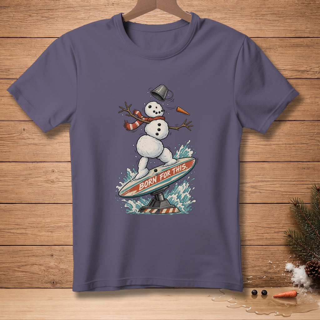 Snowman surfing on a surfboard with text "BORN FOR THIS" printed on it.