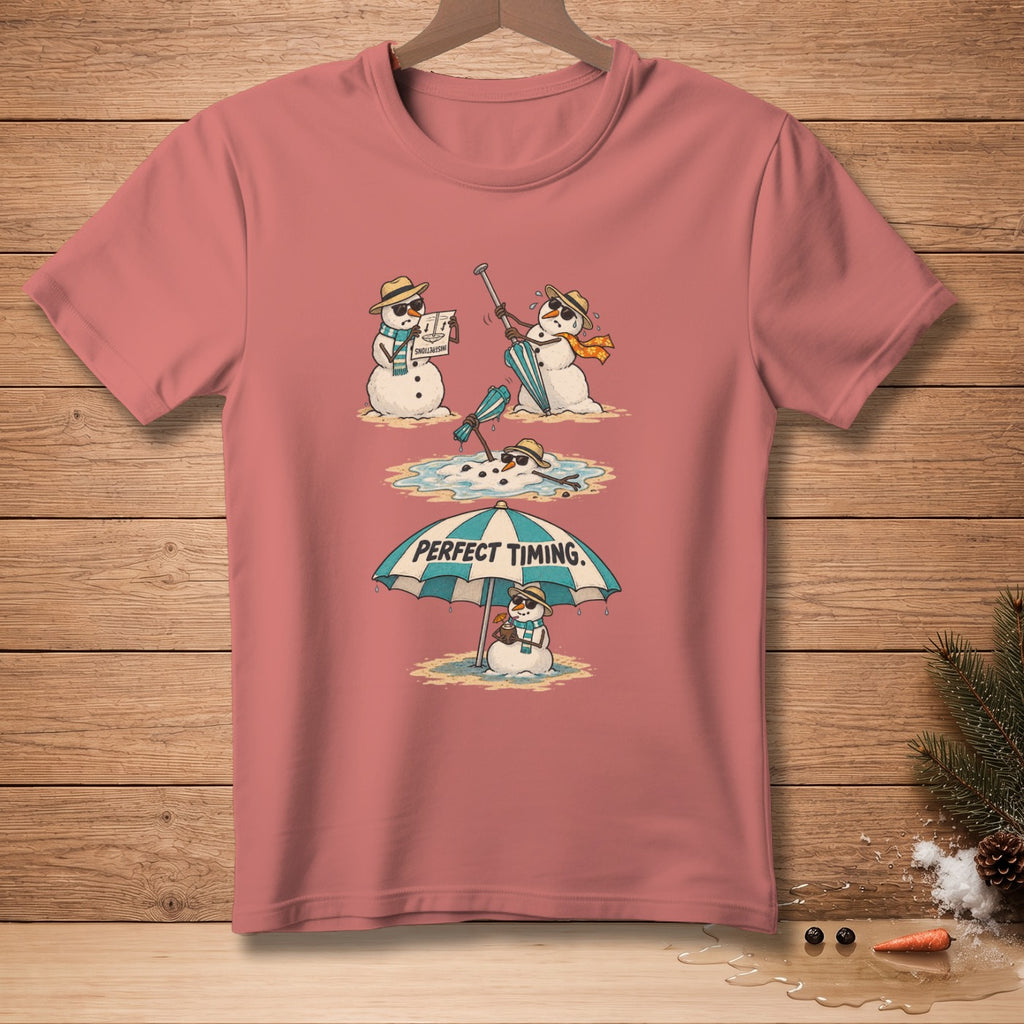 T-shirt with cartoon snowmen melting on a beach under an umbrella that says "PERFECT TIMING."