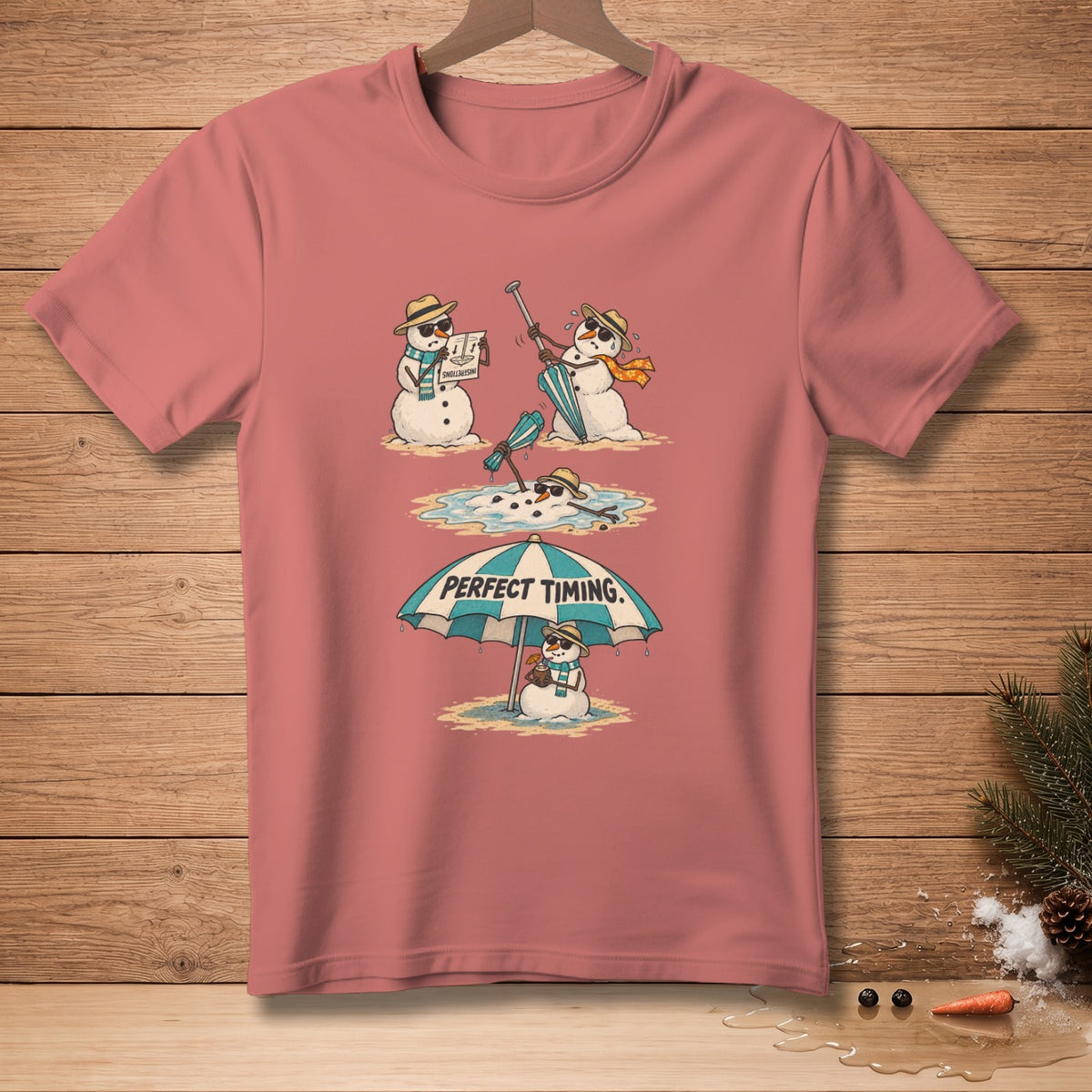T-shirt with cartoon snowmen melting on a beach under an umbrella that says "PERFECT TIMING."