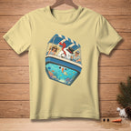 T-shirt featuring a buoyant snowman, couple, and underwater scene in a boat.