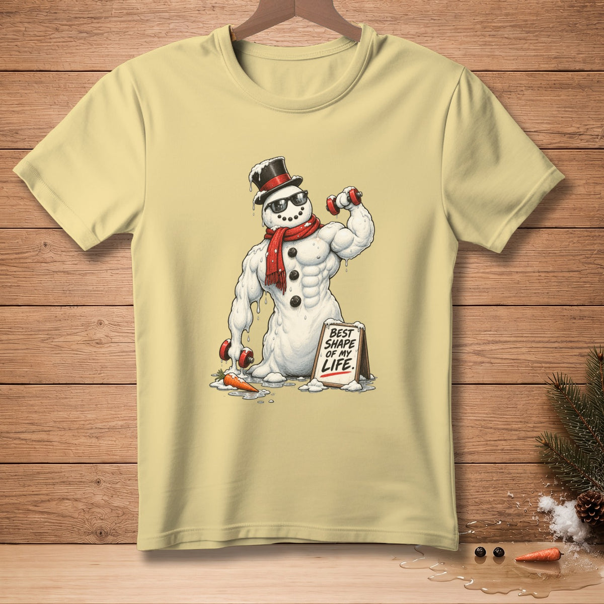 Muscular snowman in a top hat and scarf lifts dumbbells, with sign reading "Best Shape of My Life."