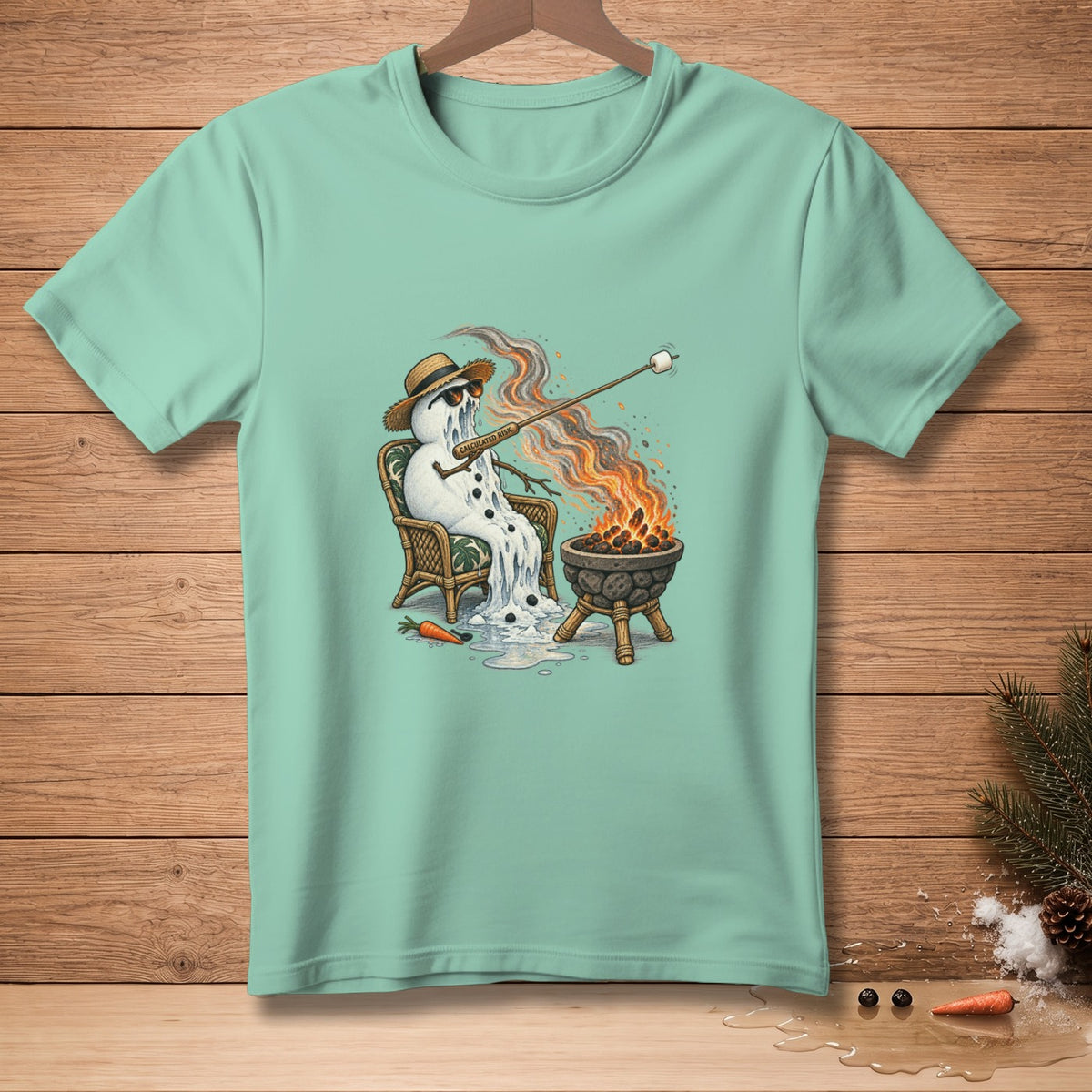 Mint t-shirt with melting snowman roasting marshmallow over fire, "Calculated Risk" text.