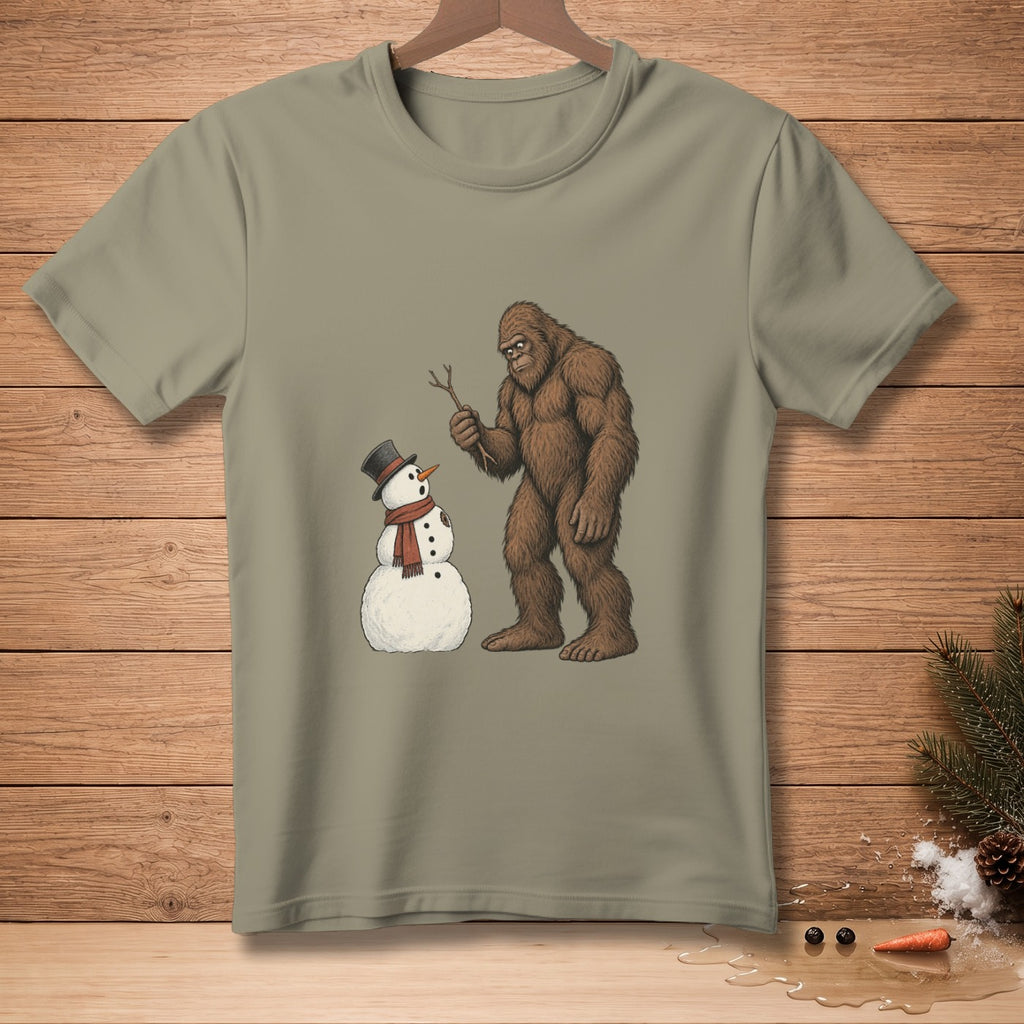 Bigfoot holding a stick next to a snowman wearing a top hat and scarf.