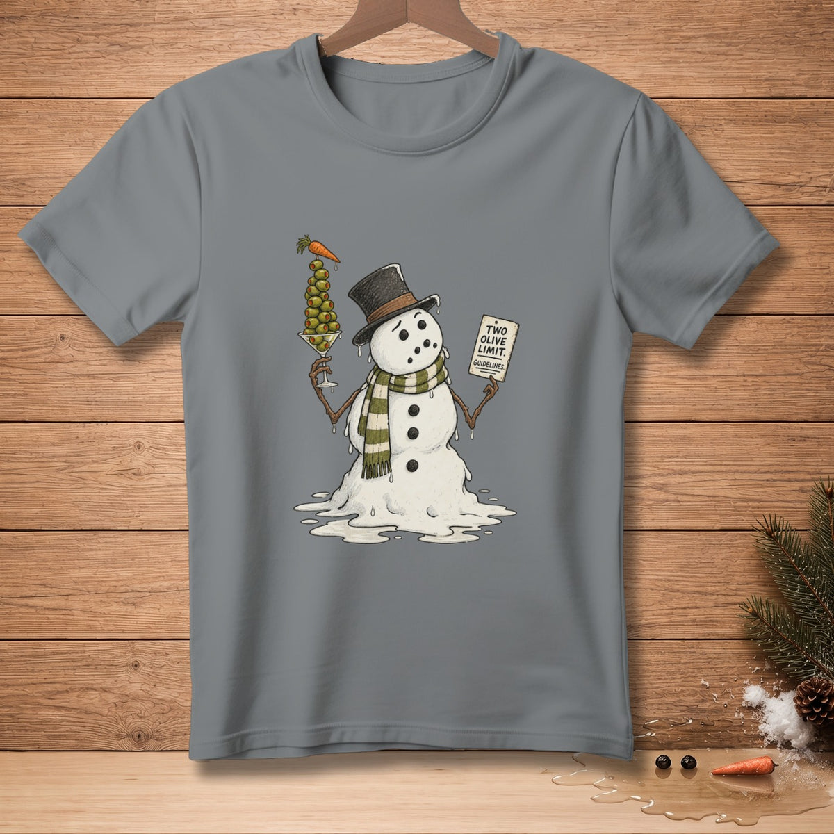Snowman in top hat holding olive martini with carrot and sign, gray t-shirt graphic.