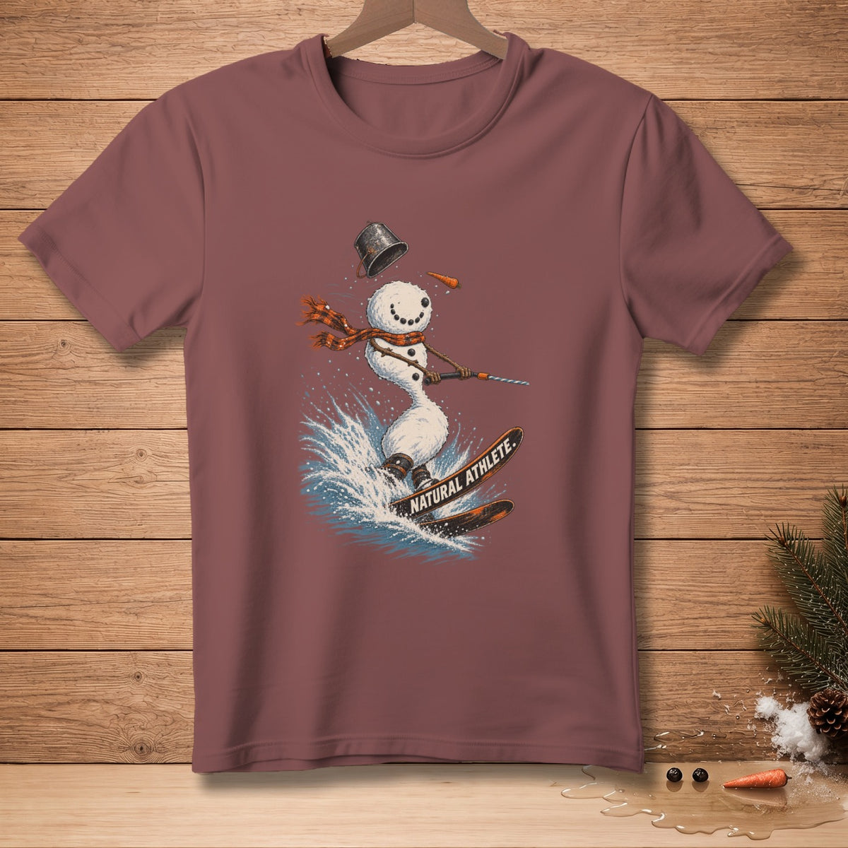 Snowman waterskiing with "NATURAL ATHLETE." text on skis.