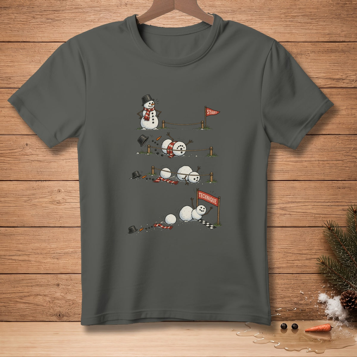 T-shirt graphic of snowmen failing at a race, with "Start" and "Technique" signs.