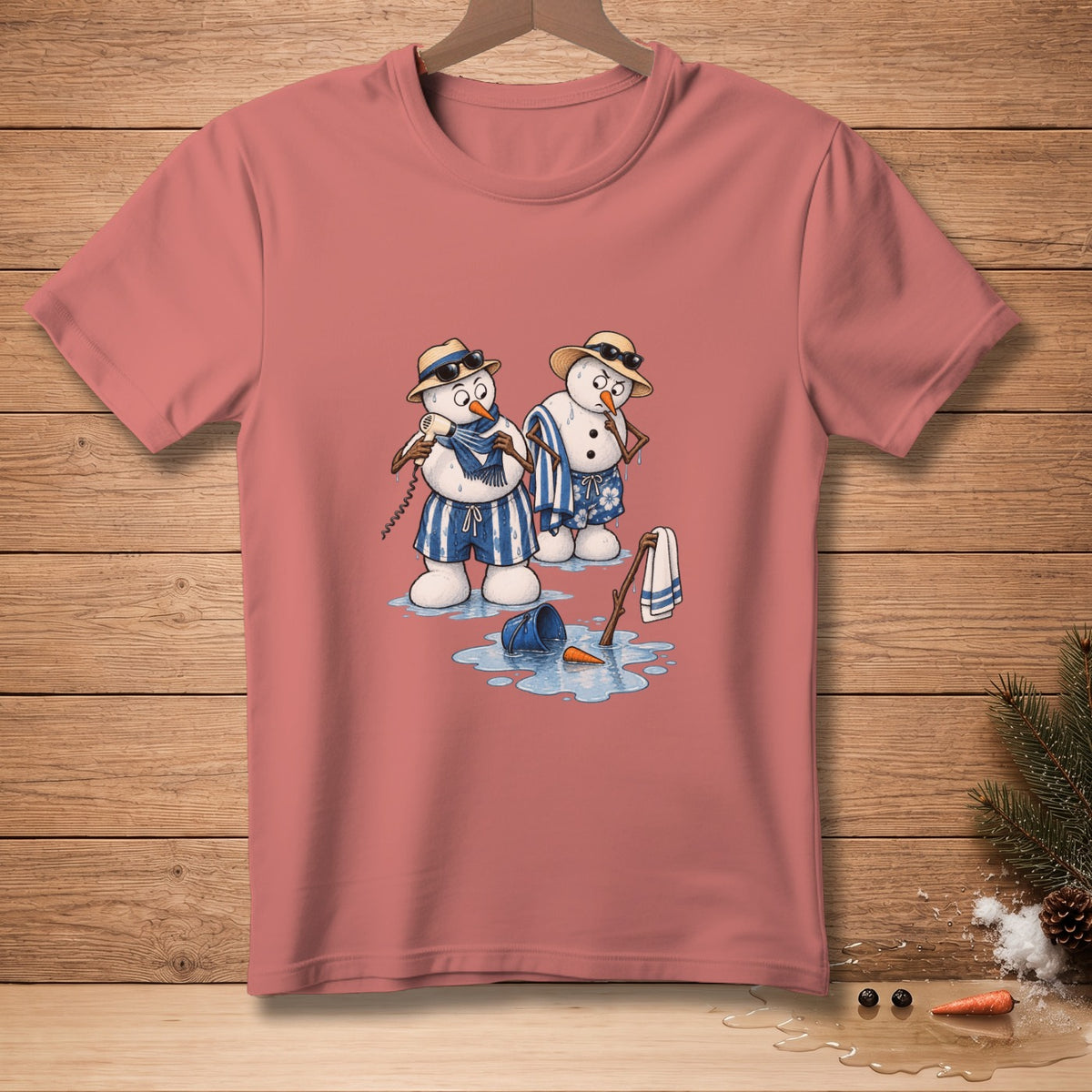 Two melting snowmen in swim trunks and hats on a pink t-shirt.