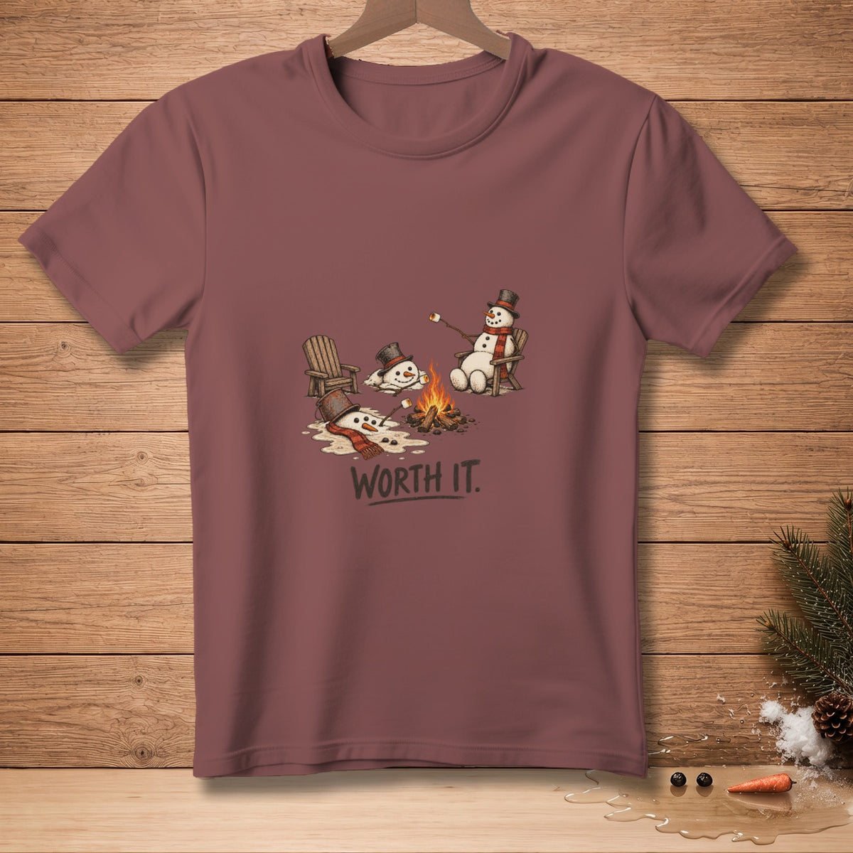 T-shirt graphic of melting snowmen roasting marshmallows by a campfire, with text "WORTH IT."