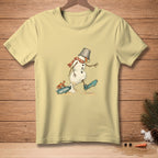 Light yellow t-shirt with melting snowman graphic, bucket hat, and scarf.