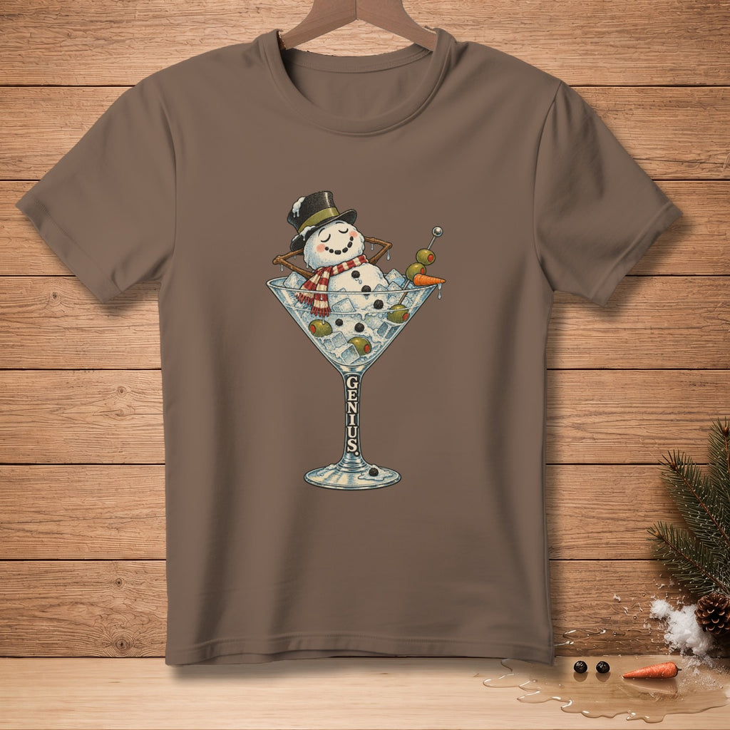 Snowman in martini glass with olives, carrot, and "GENIUS" text on brown t-shirt.