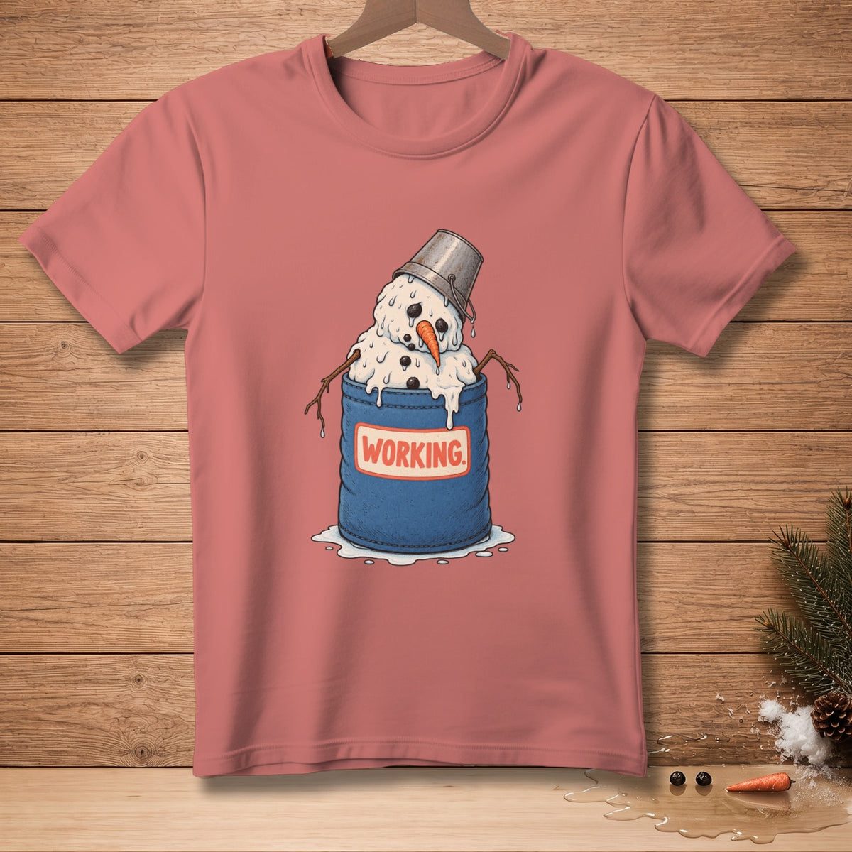 Pink t-shirt with melting snowman in bucket saying "WORKING."