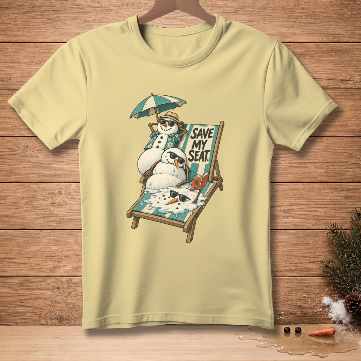 Two melting snowmen relax on a striped beach chair under an umbrella with text "SAVE MY SEAT."