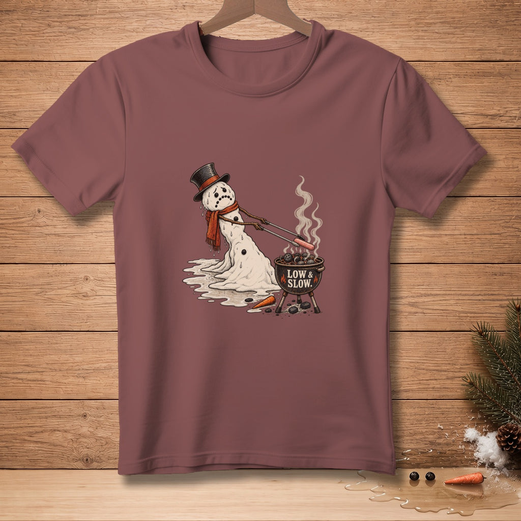 Melting snowman with top hat grills hot dogs with text "LOW & SLOW."