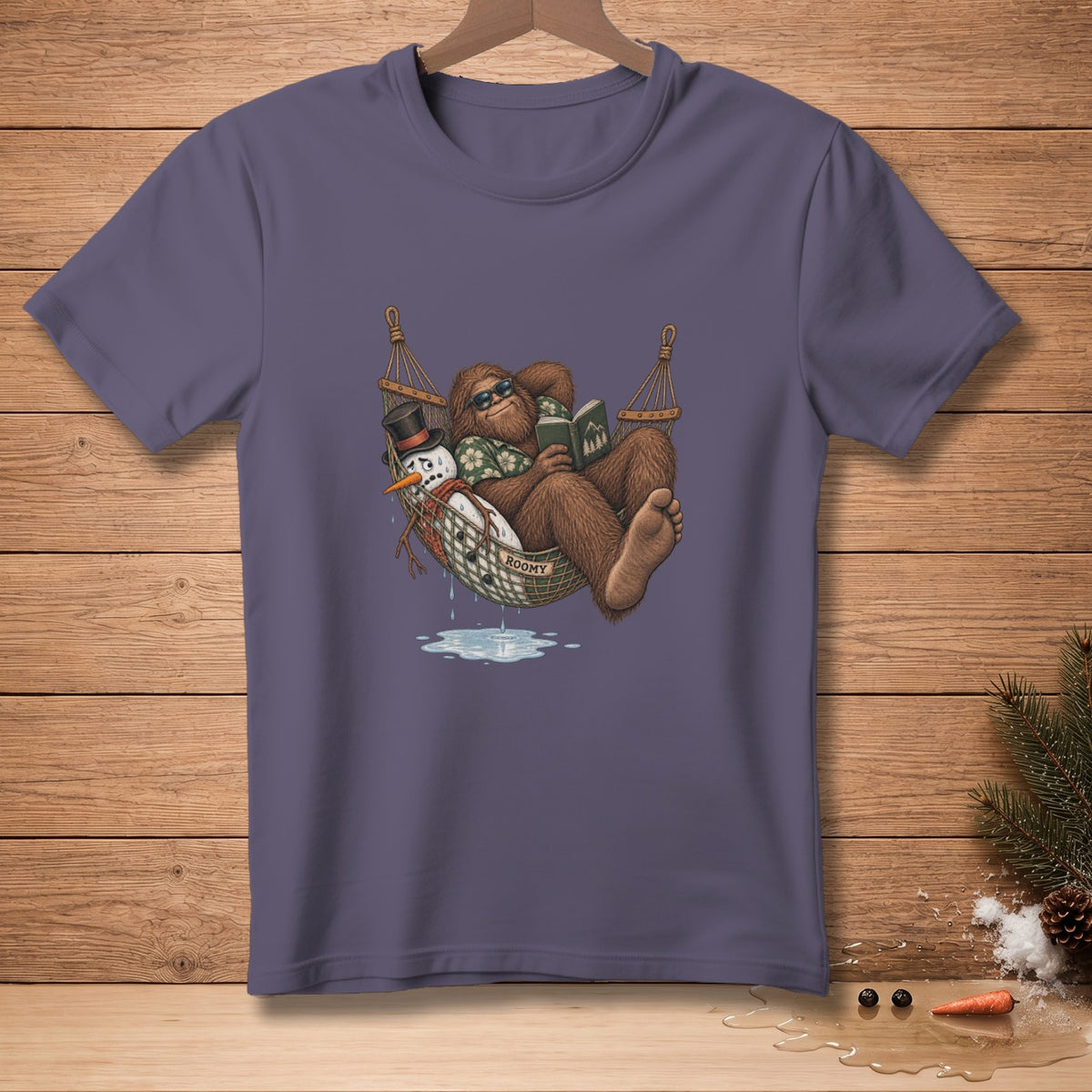 Bigfoot reading in a hammock with a melting snowman, text reads "ROOMY".