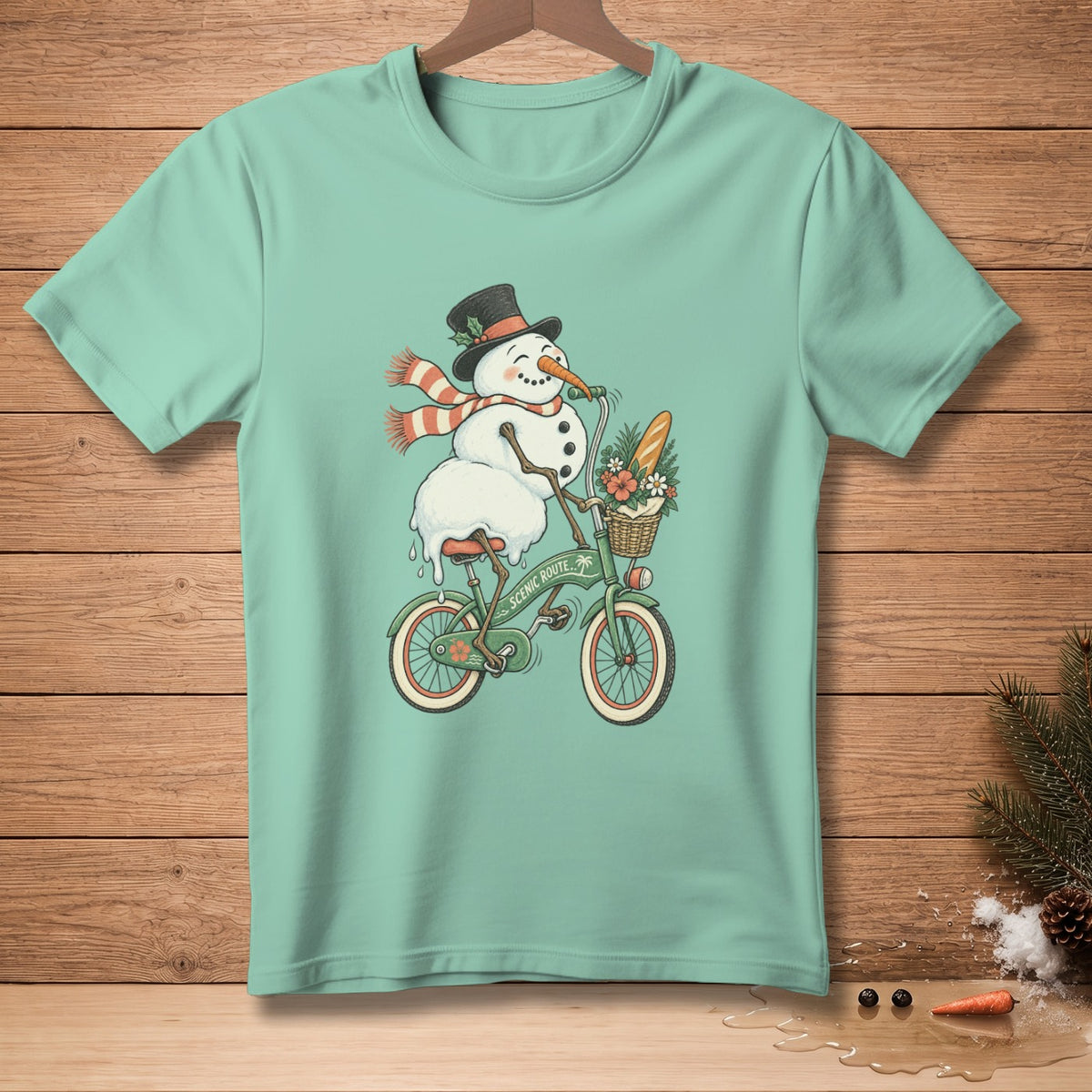 Snowman in top hat and scarf rides bicycle with basket of flowers and bread.