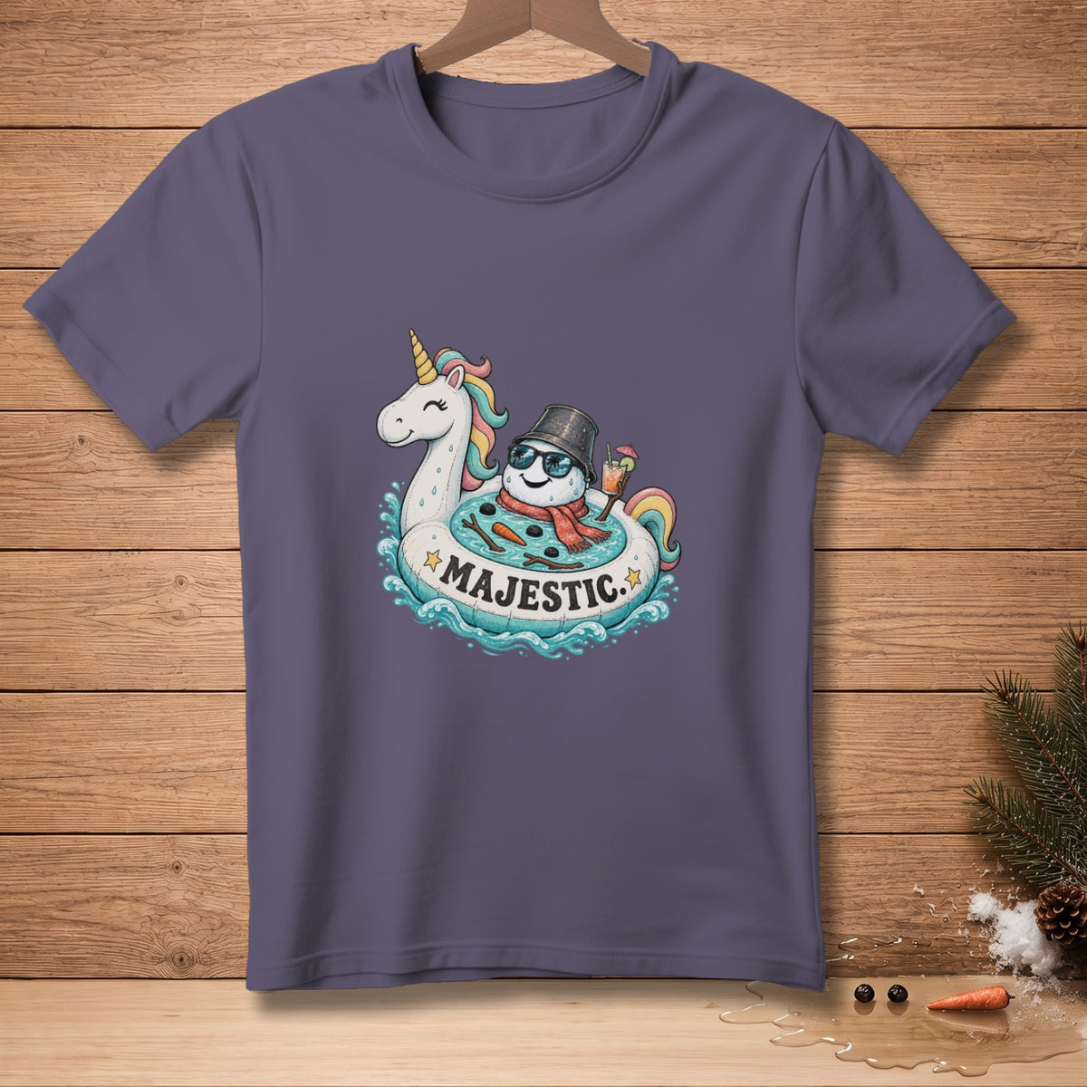 T-shirt with snowman and unicorn on inner tube with text "MAJESTIC."