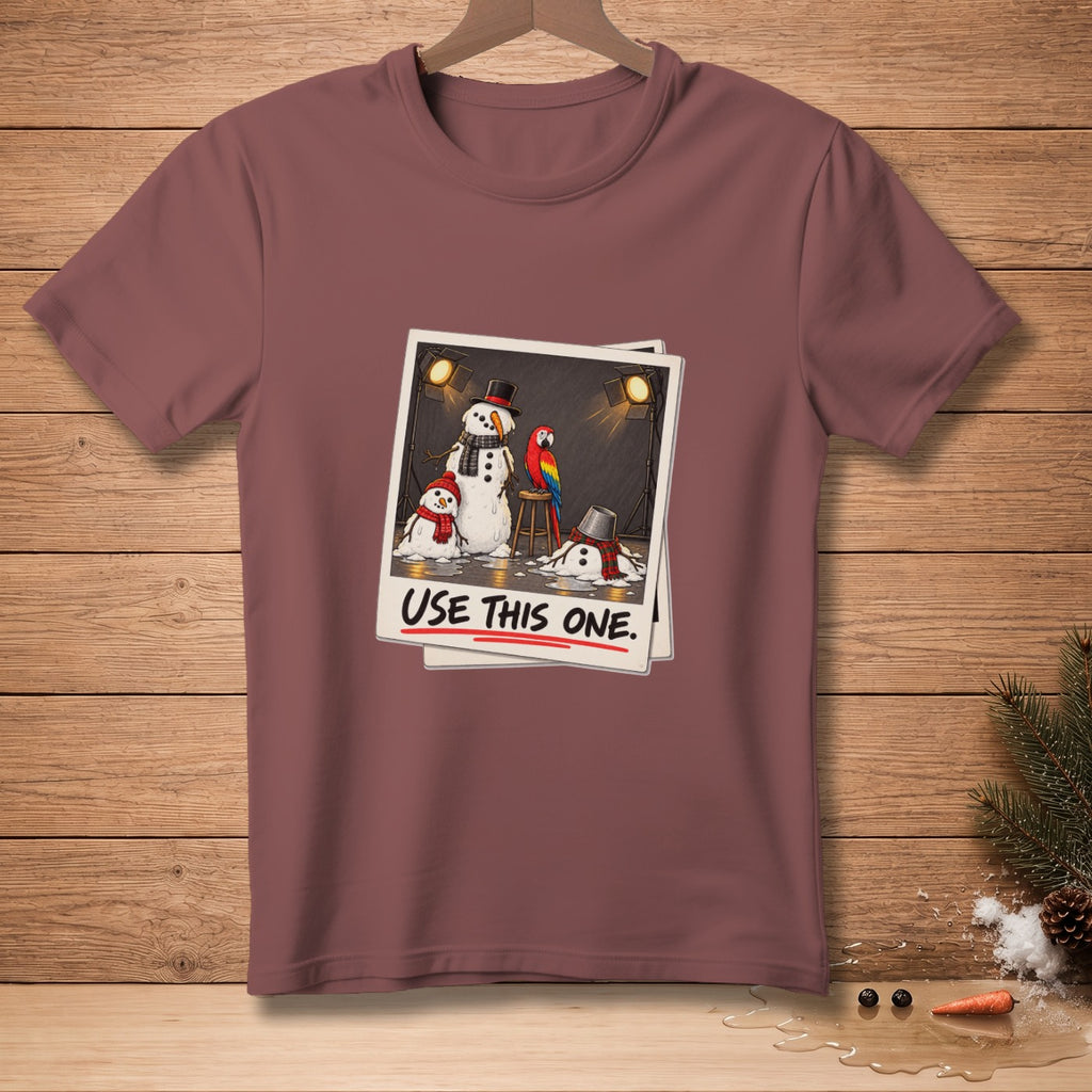 T-shirt with a polaroid design of melting snowmen and a parrot, reading "USE THIS ONE."