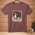 T-shirt with a polaroid design of melting snowmen and a parrot, reading "USE THIS ONE."
