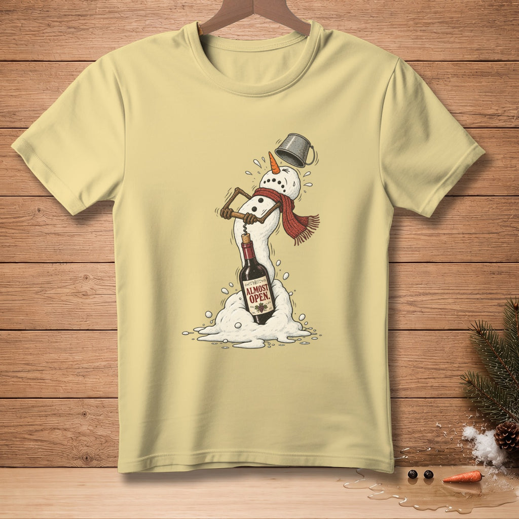 Melting snowman with corkscrew, wine bottle labeled "Almost Open" on a light yellow t-shirt.
